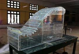Tính toán tiêu năng dòng mặt sau bậc thụt có mũi hất cong và góc hất lớn